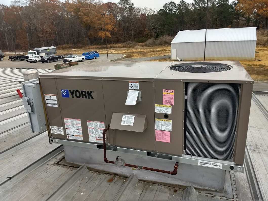sms_york_installation SMS technicians installing commercial HVAC equipment